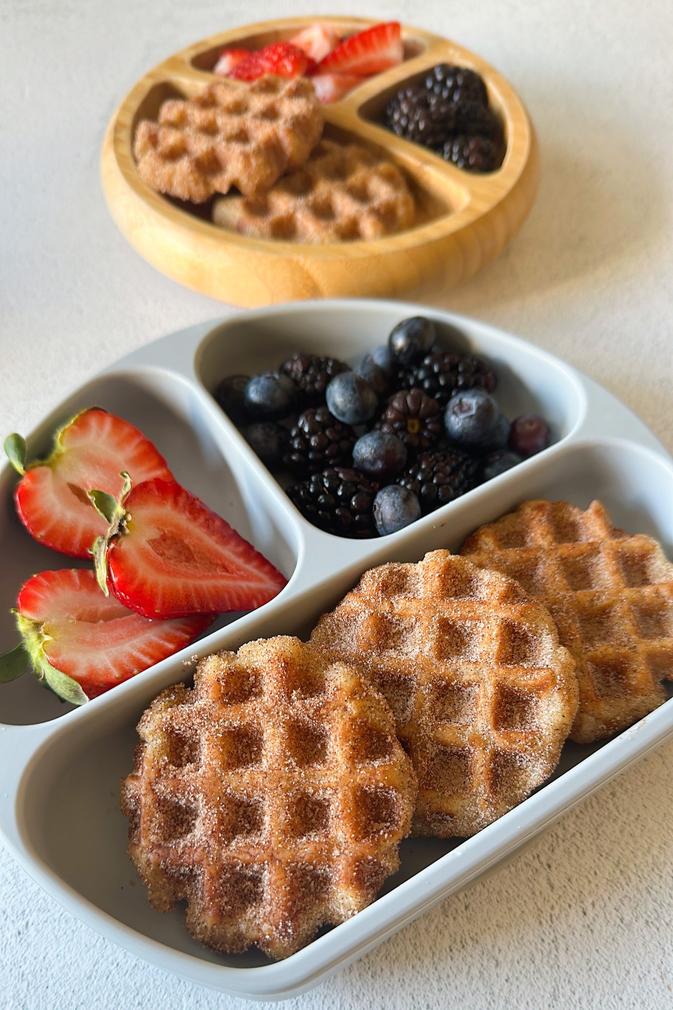 Churro waffles served with berries.