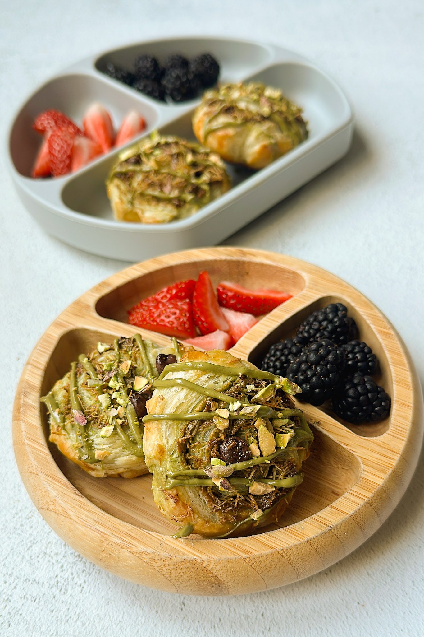 Dubai chocolate rolls served with berries.