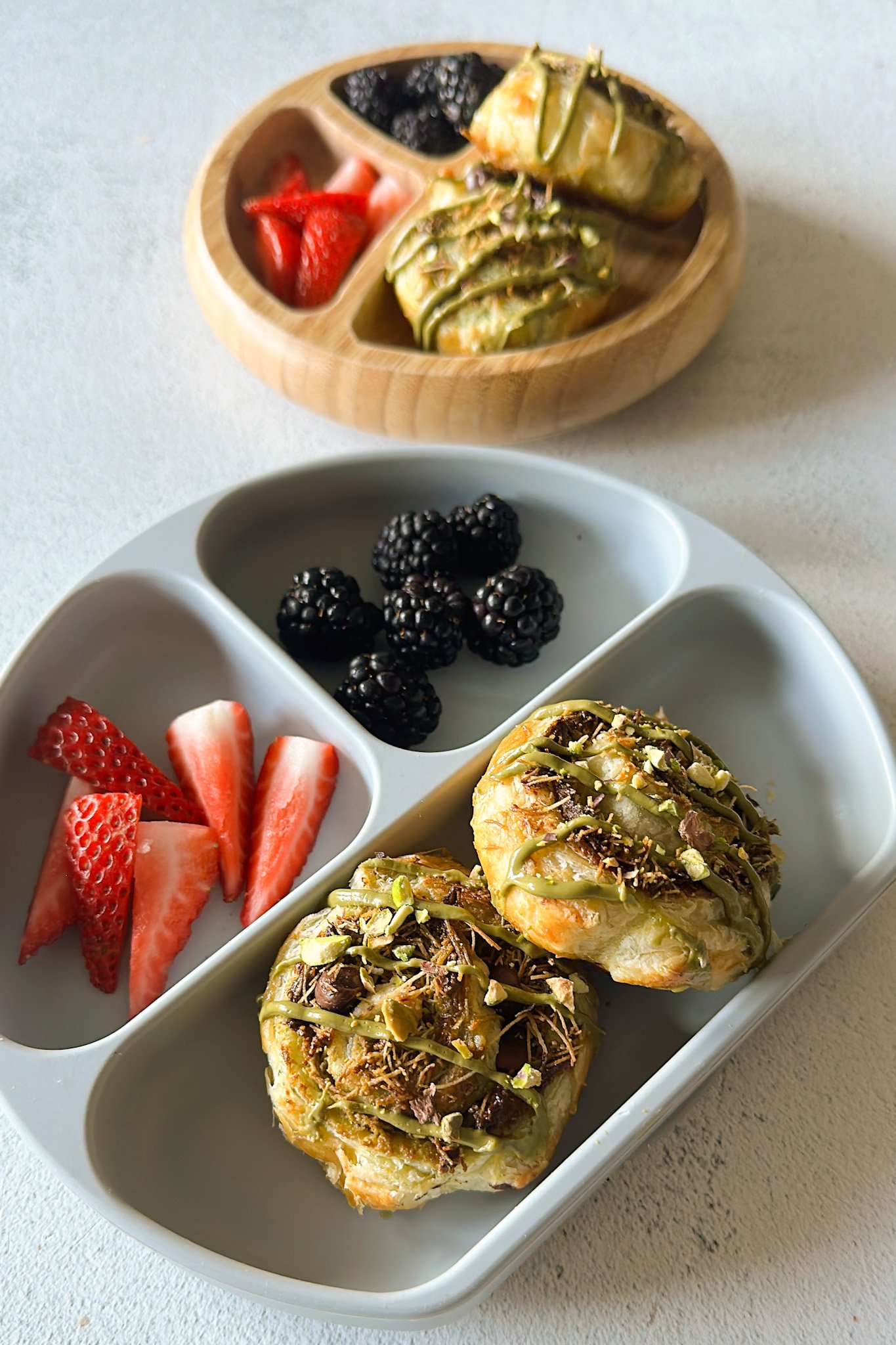 Dubai chocolate rolls served with berries.