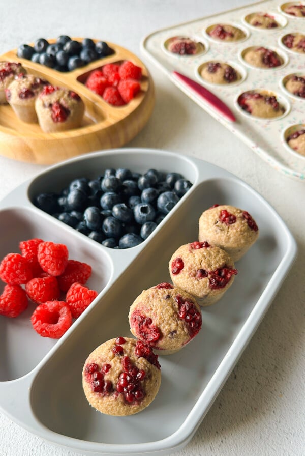 Banana blackberry oatmeal muffins served with berries