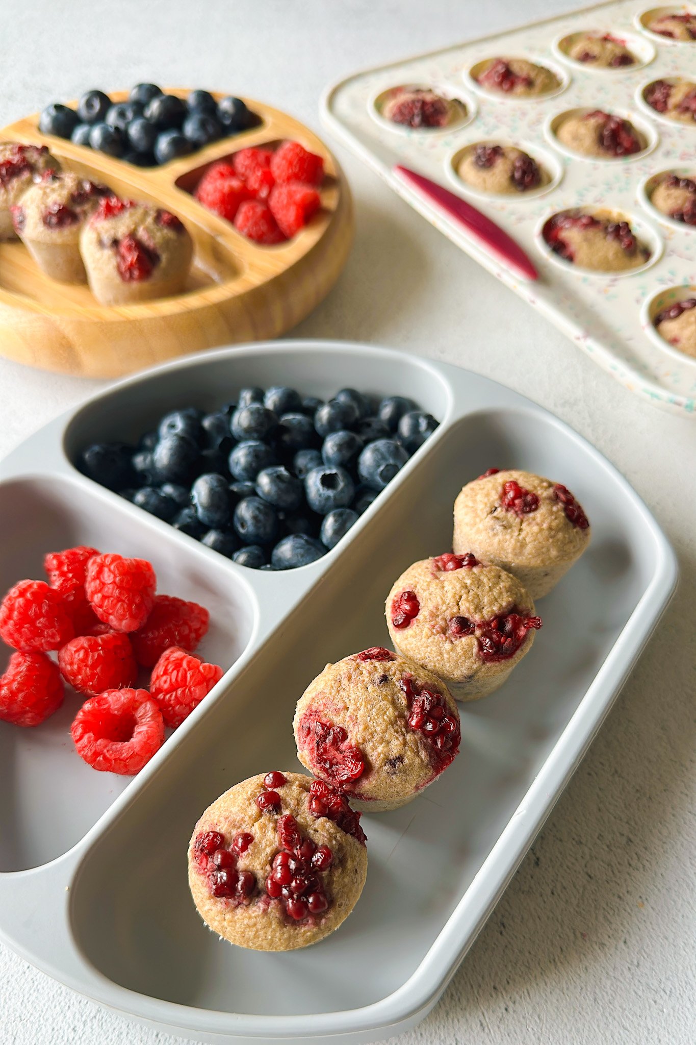 Banana blackberry oatmeal muffins served with berries