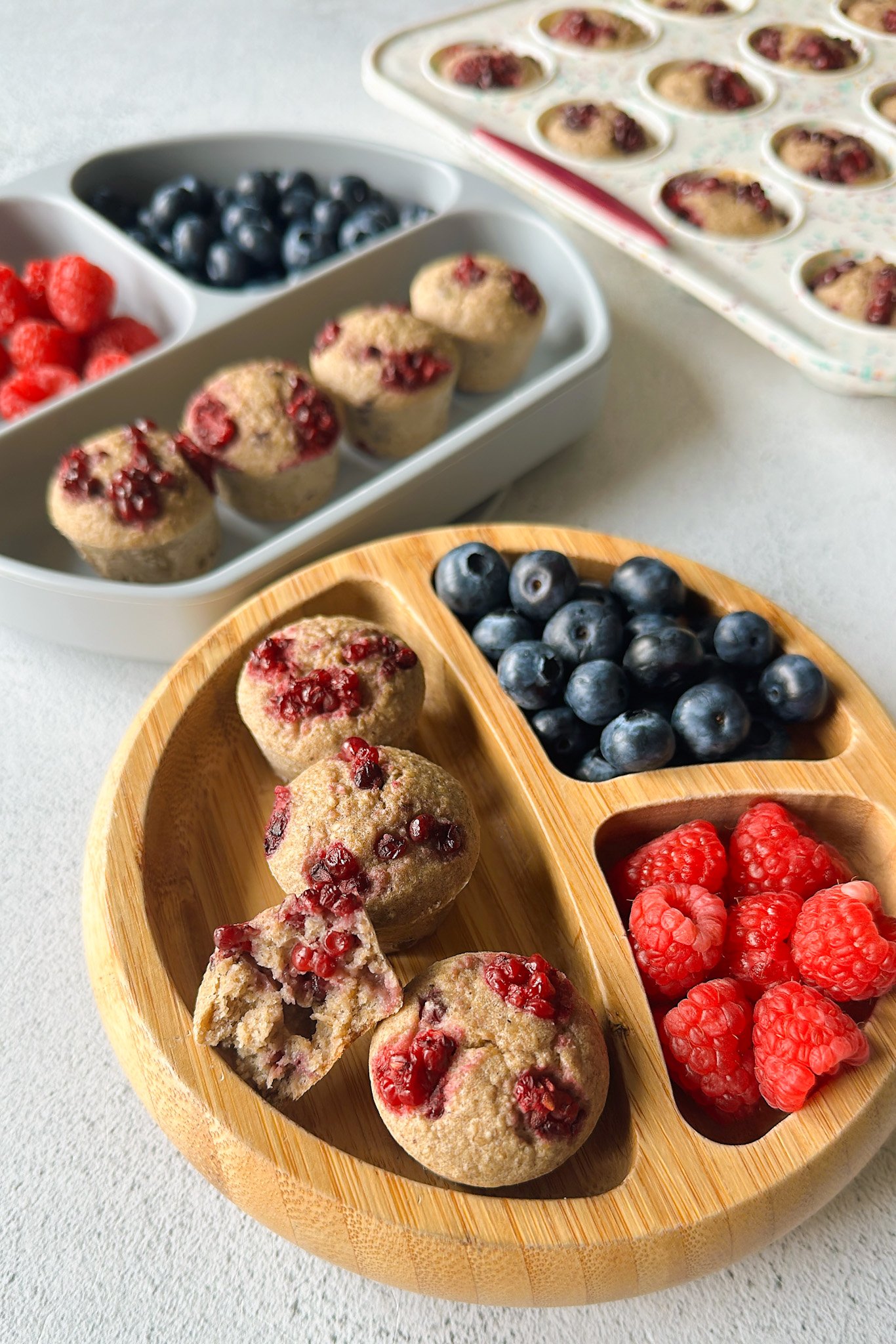 Banana blackberry oatmeal muffins served with berries