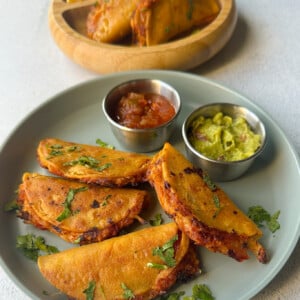 Mini chicken tacos served with dips.