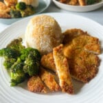 Crispy panko chicken served with broccoli and rice.