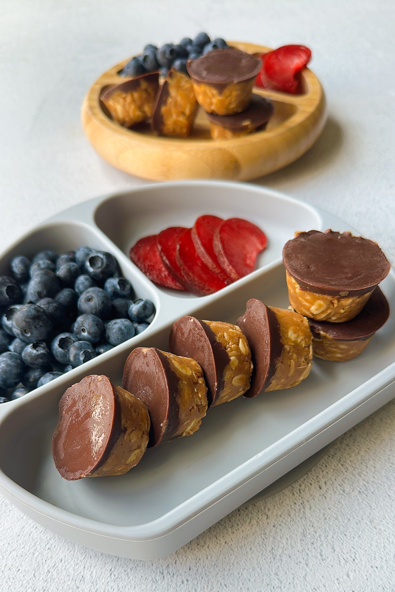 Peanut butter oatmeal cups served with berries.