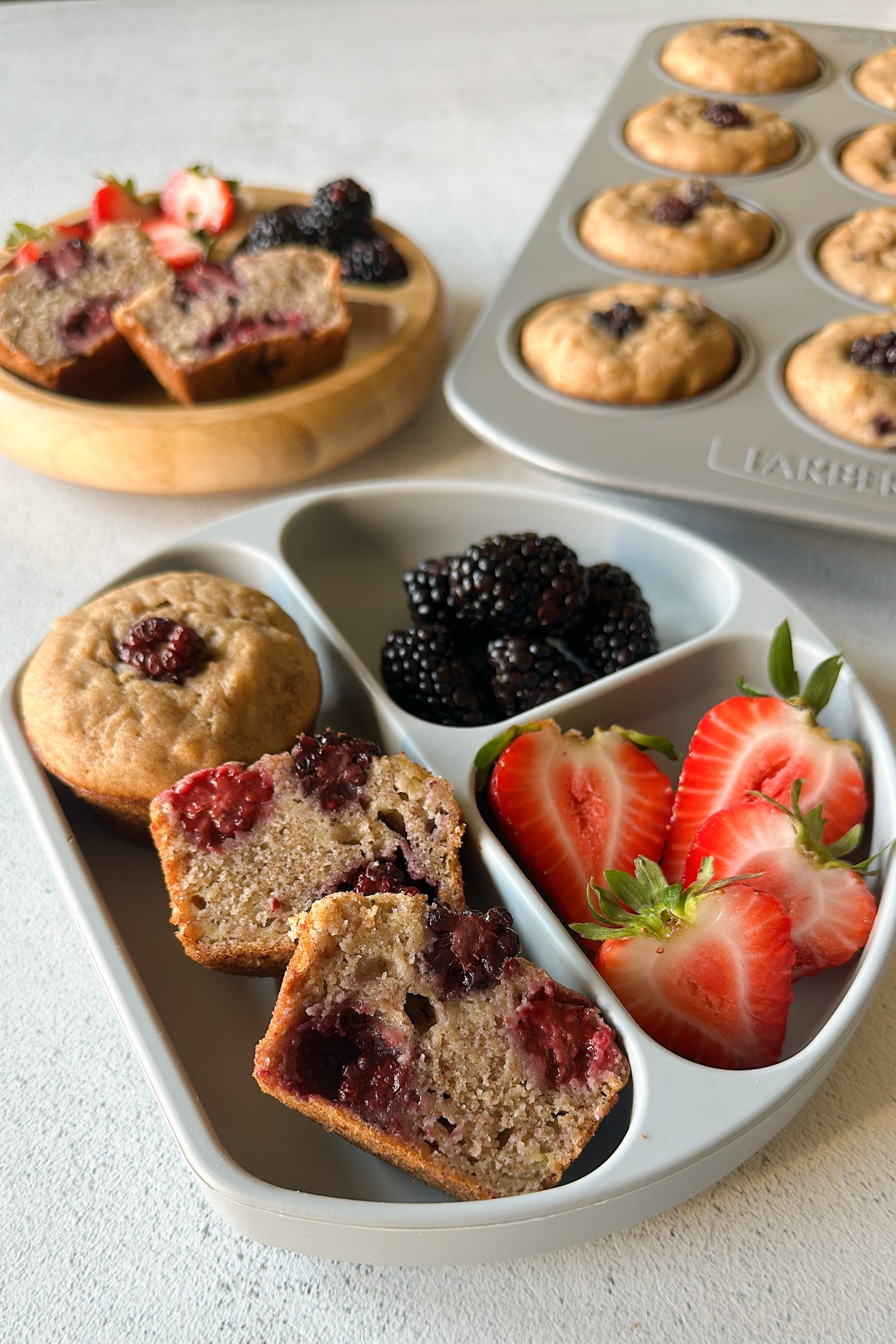Banana blackberry muffins served with berries.