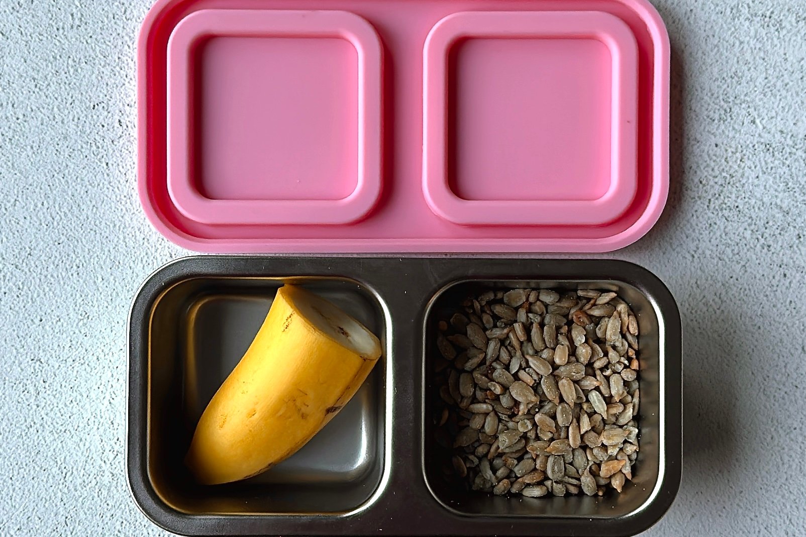 Banana and sunflower seeds snackbox.