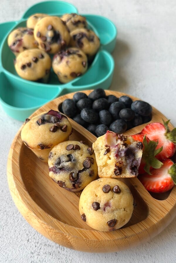 Blueberry and chocolate chip muffins served with berries.