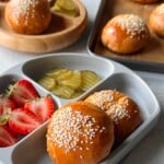 Cheeseburger bombs served with pickles and strawberries.