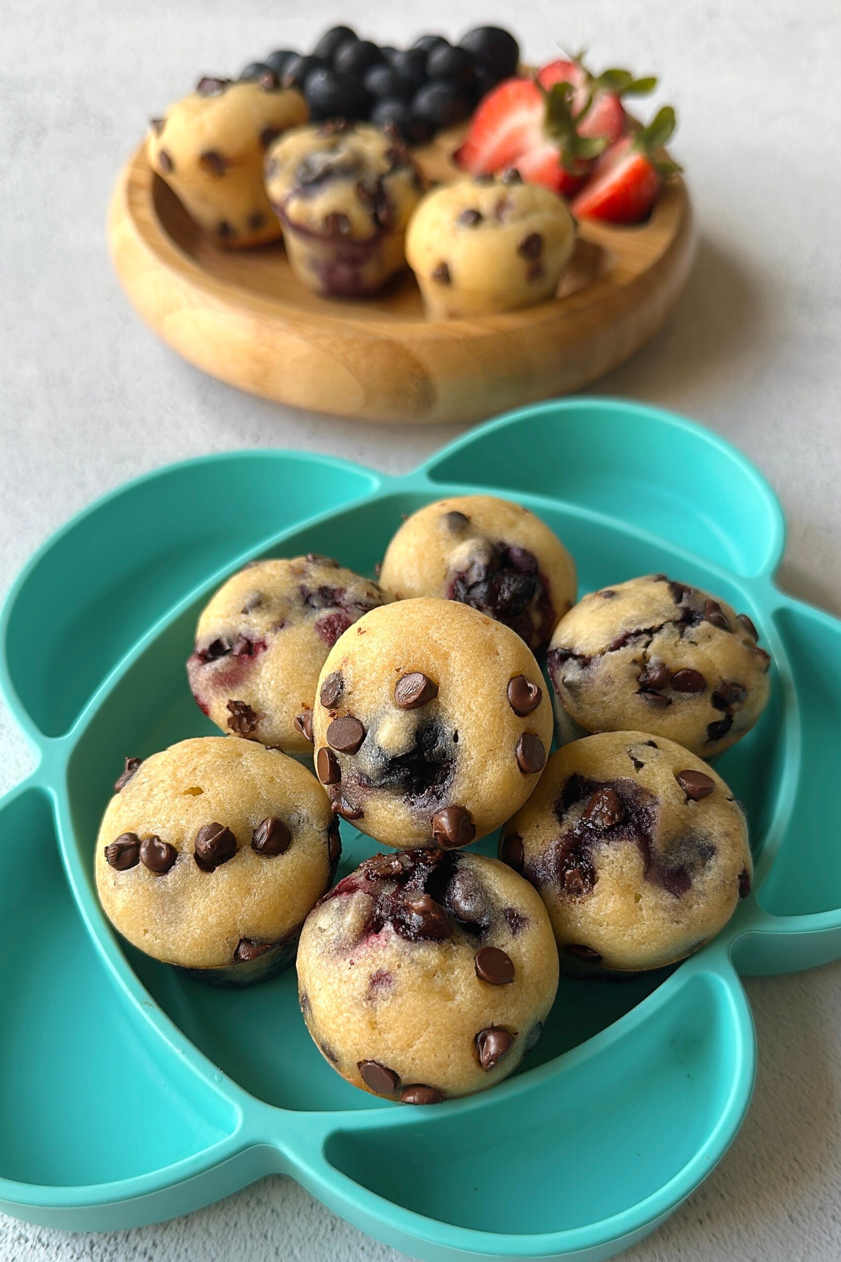 Blueberry and chocolate chip muffins served with berries.