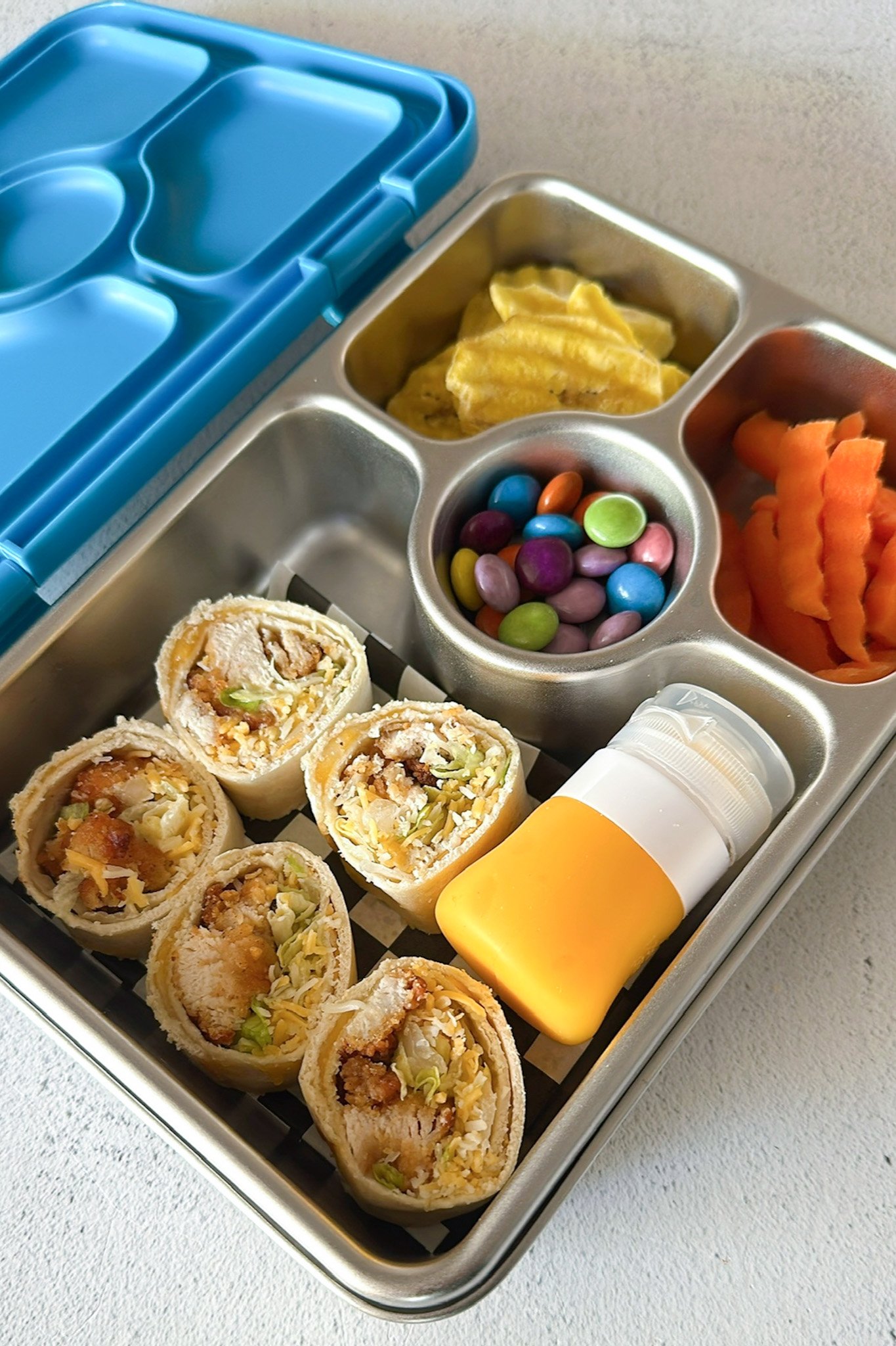 Chicken nuggets wrap served in a lunchbox.
