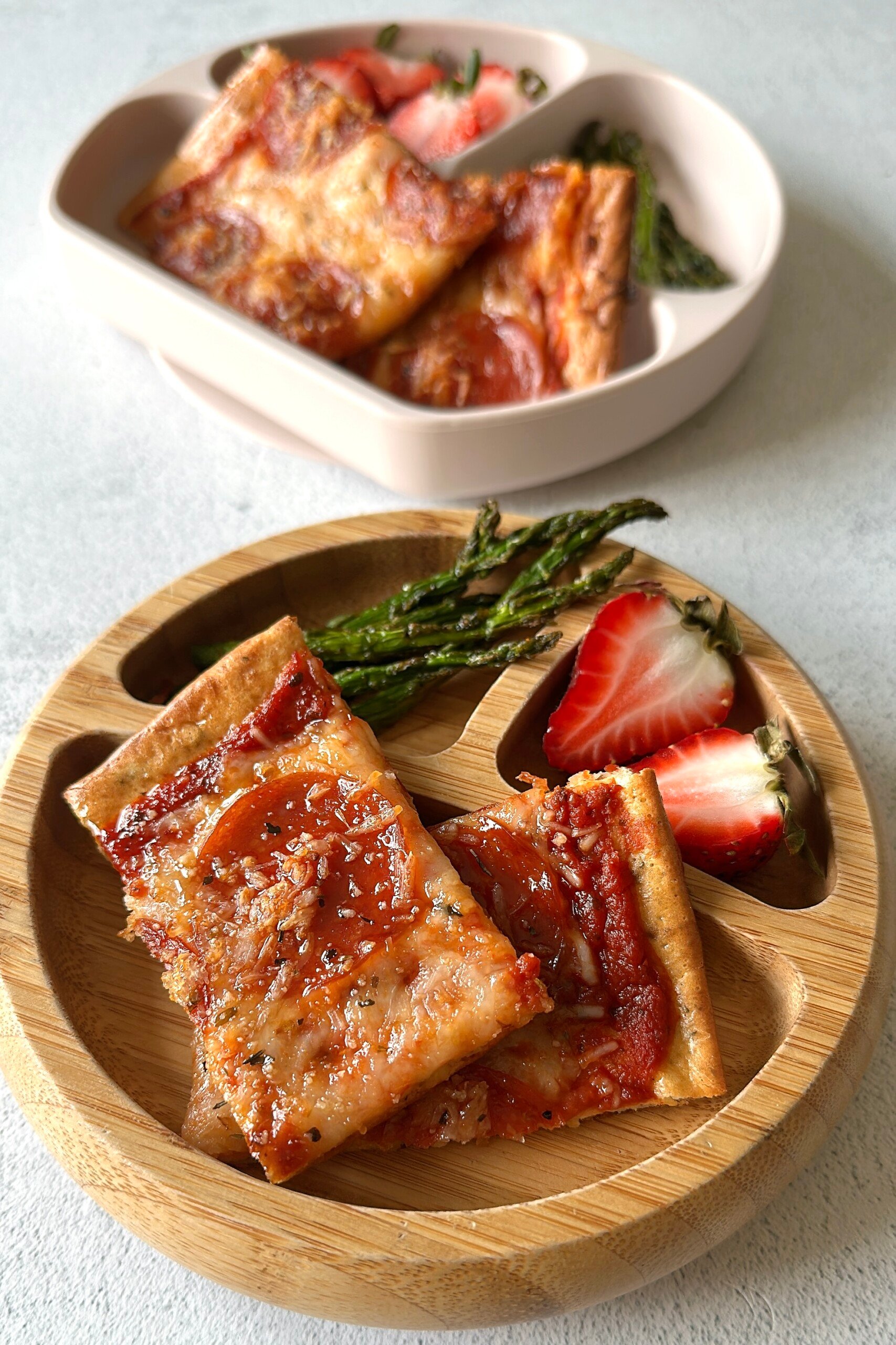 Cottage cheese pizza served with strawberries and asparagus.