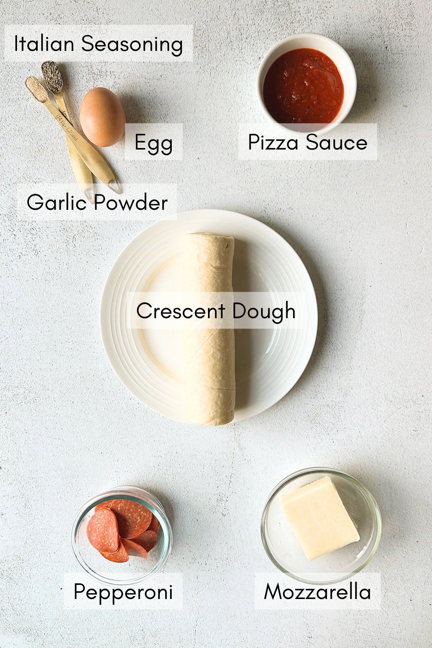 Ingredients to make crescent pizza rolls.