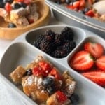 Sourdough French toast casserole served with berries.