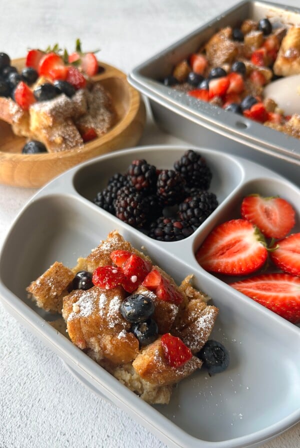 Sourdough French toast casserole served with berries.