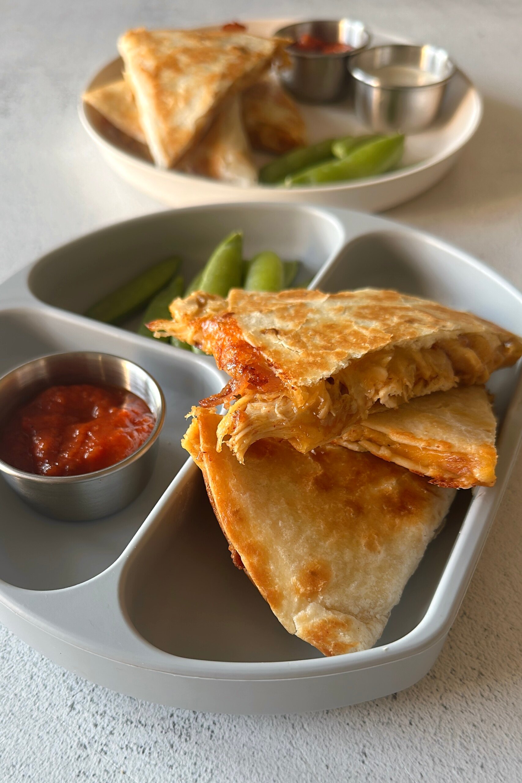 Chicken bacon ranch quesadillas served with salsa and ranch dressing.