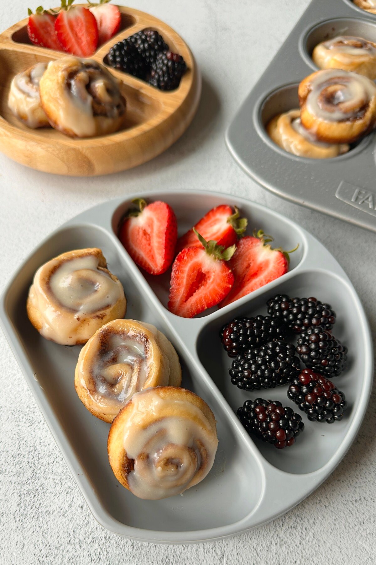 Cinnamon roll crescent rolls served with berries.