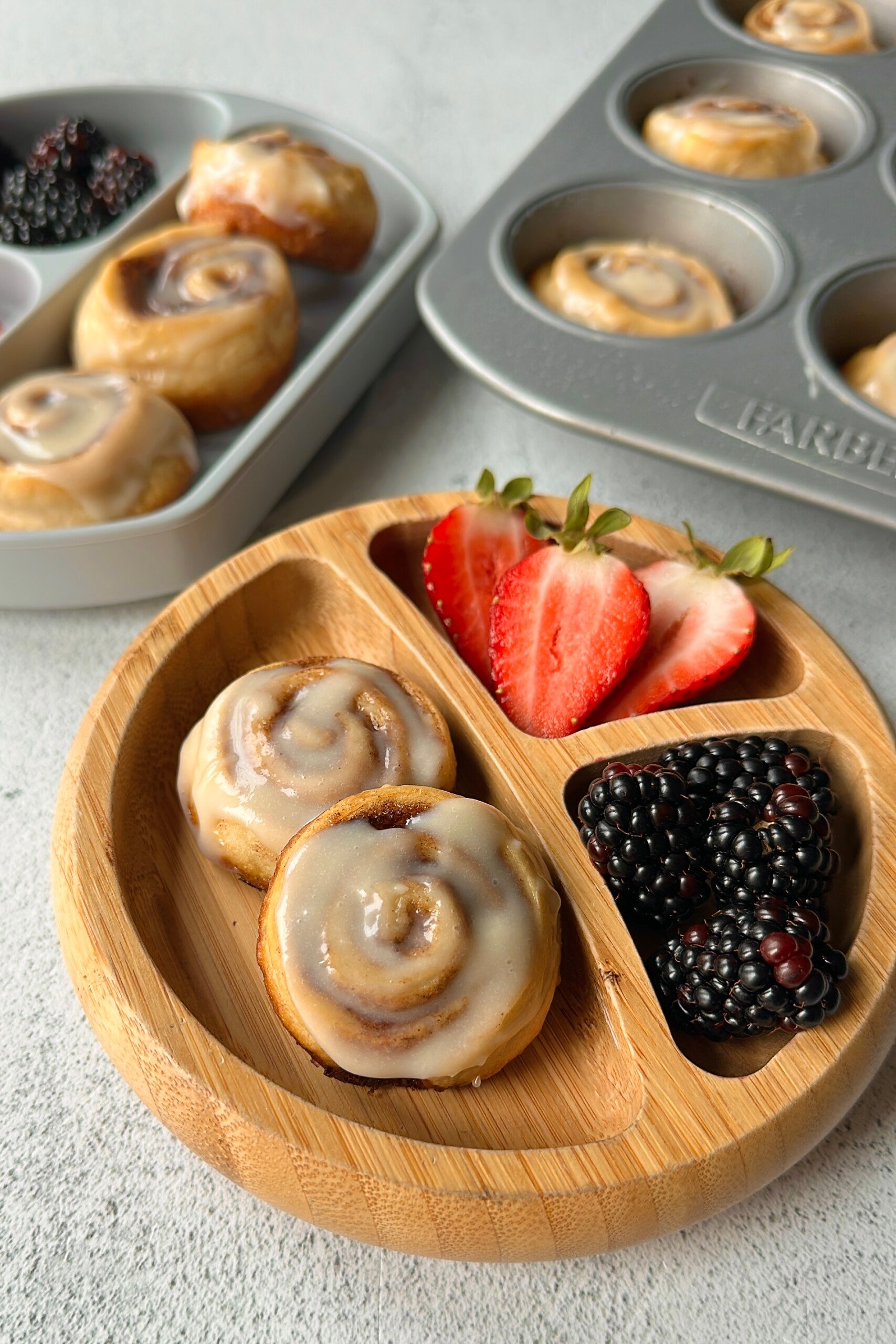 Cinnamon roll crescent rolls served with berries.