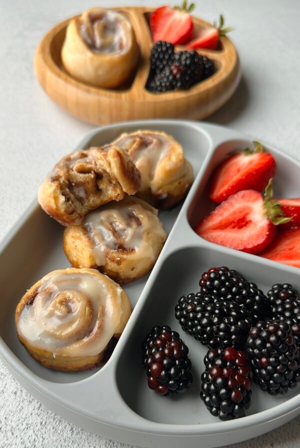 Cinnamon roll crescent rolls served with berries.