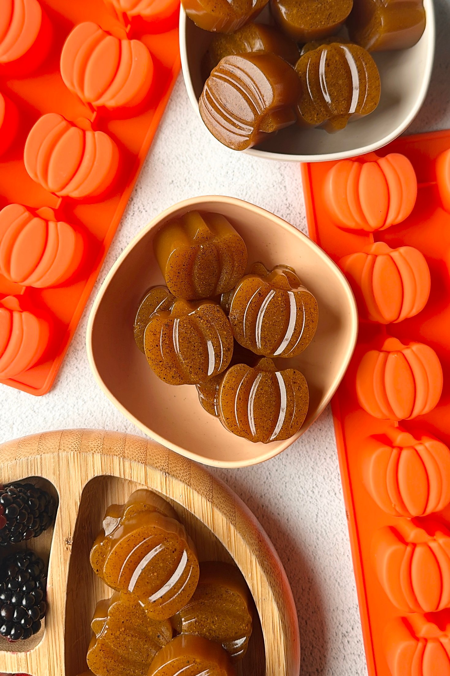 Pumpkin gummies served with berries.