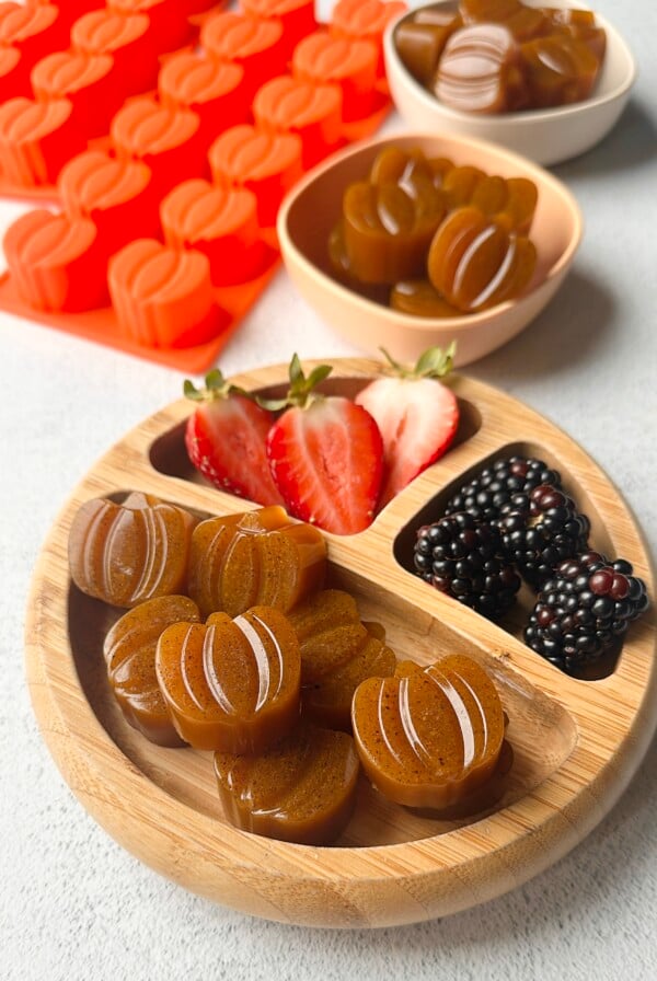 Pumpkin gummies served with berries.