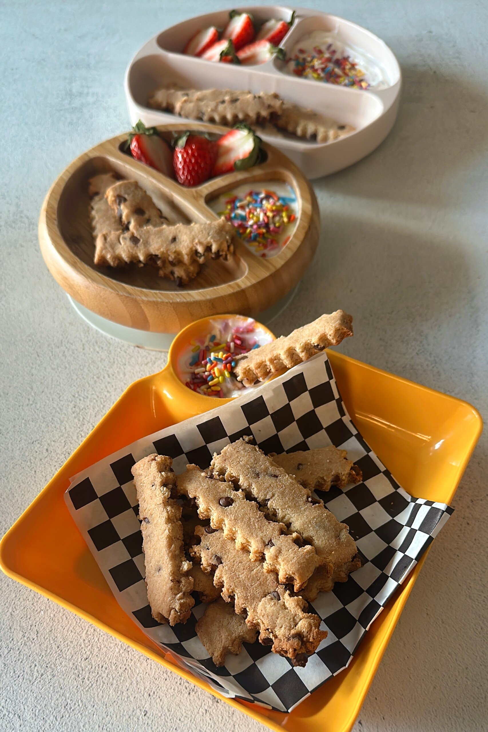 Chocolate chip cookie fries served with strawberries and yogurt dip.