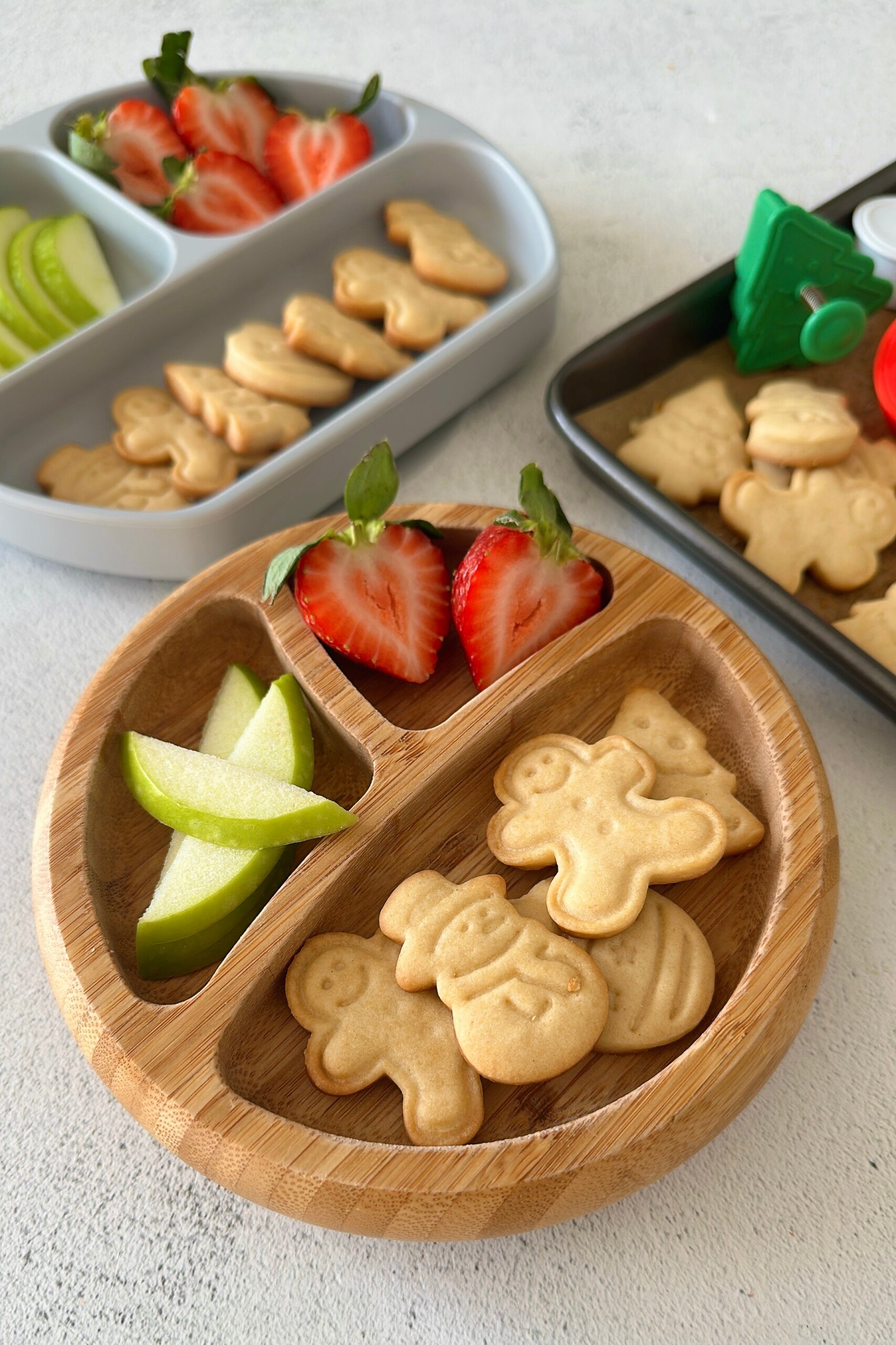 Mini sugar cookies served with fruits.