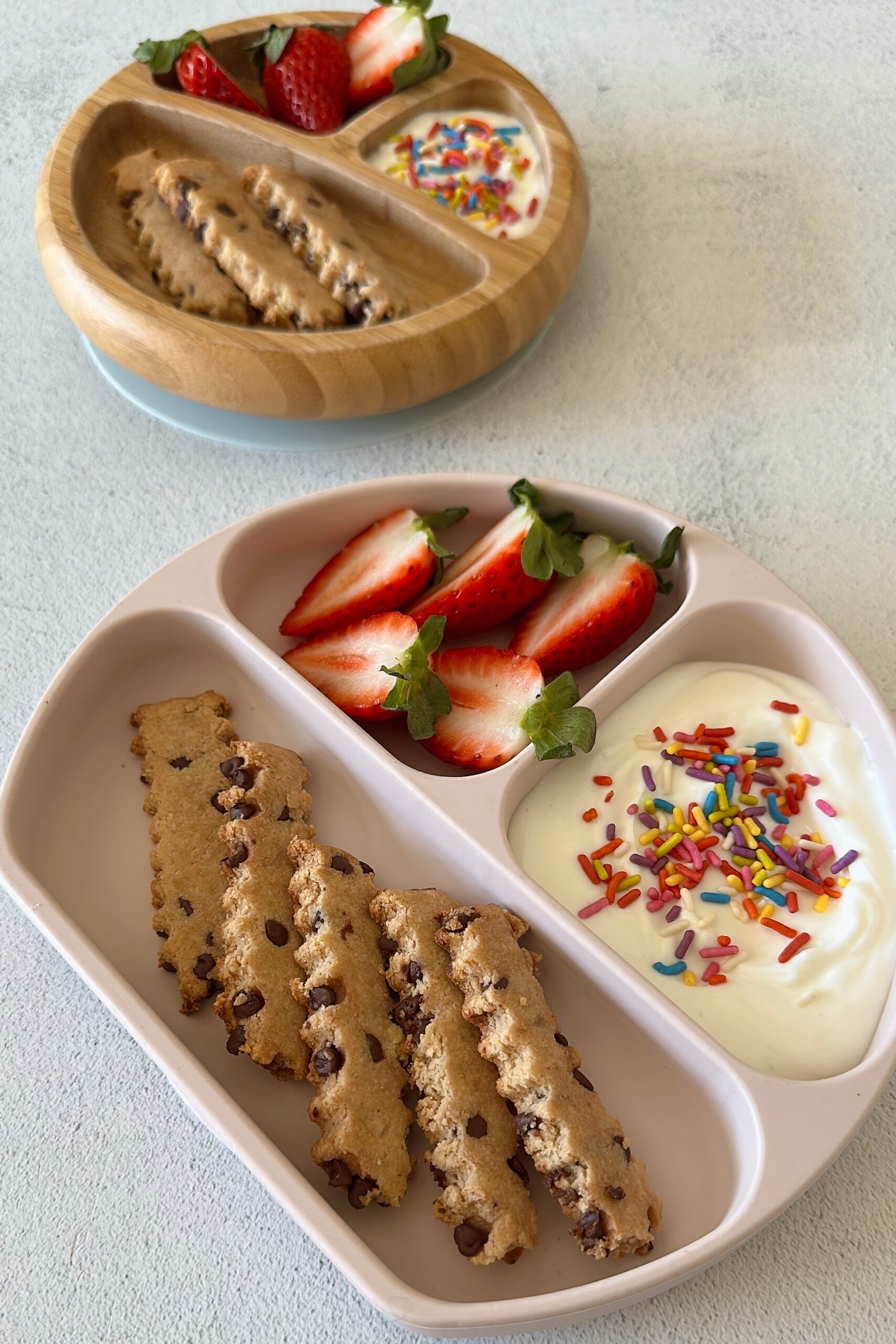 Chocolate chip cookie fries served with strawberries and yogurt dip.