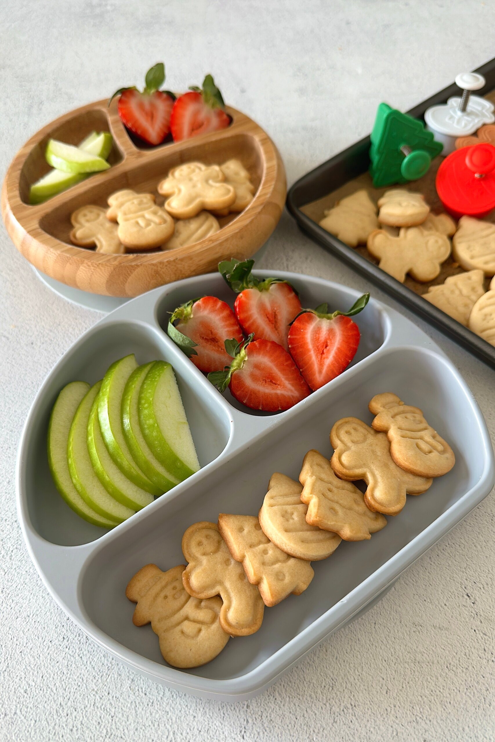 Mini sugar cookies served with fruits.