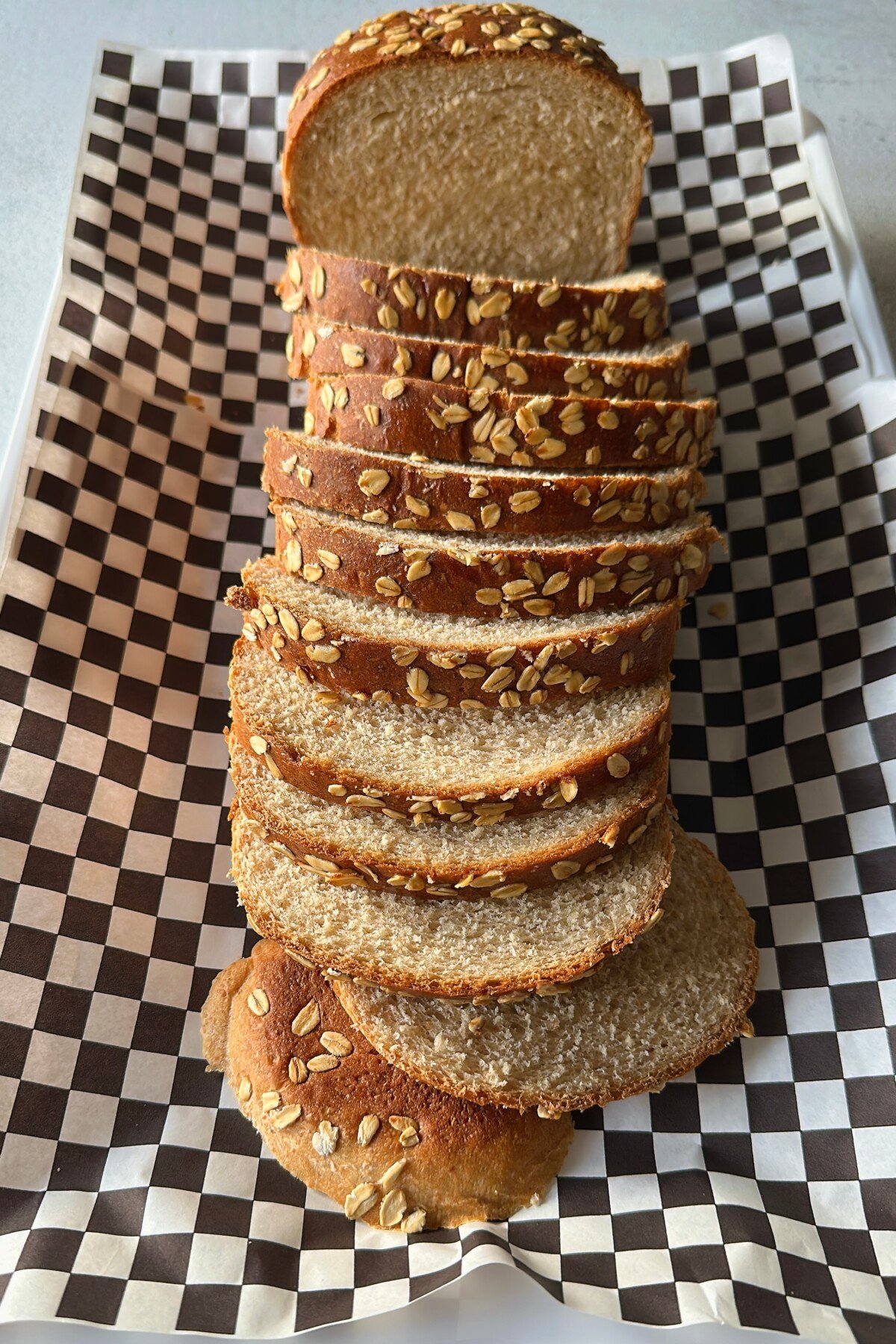 Honey wheat sandwich bread loaf sliced.
