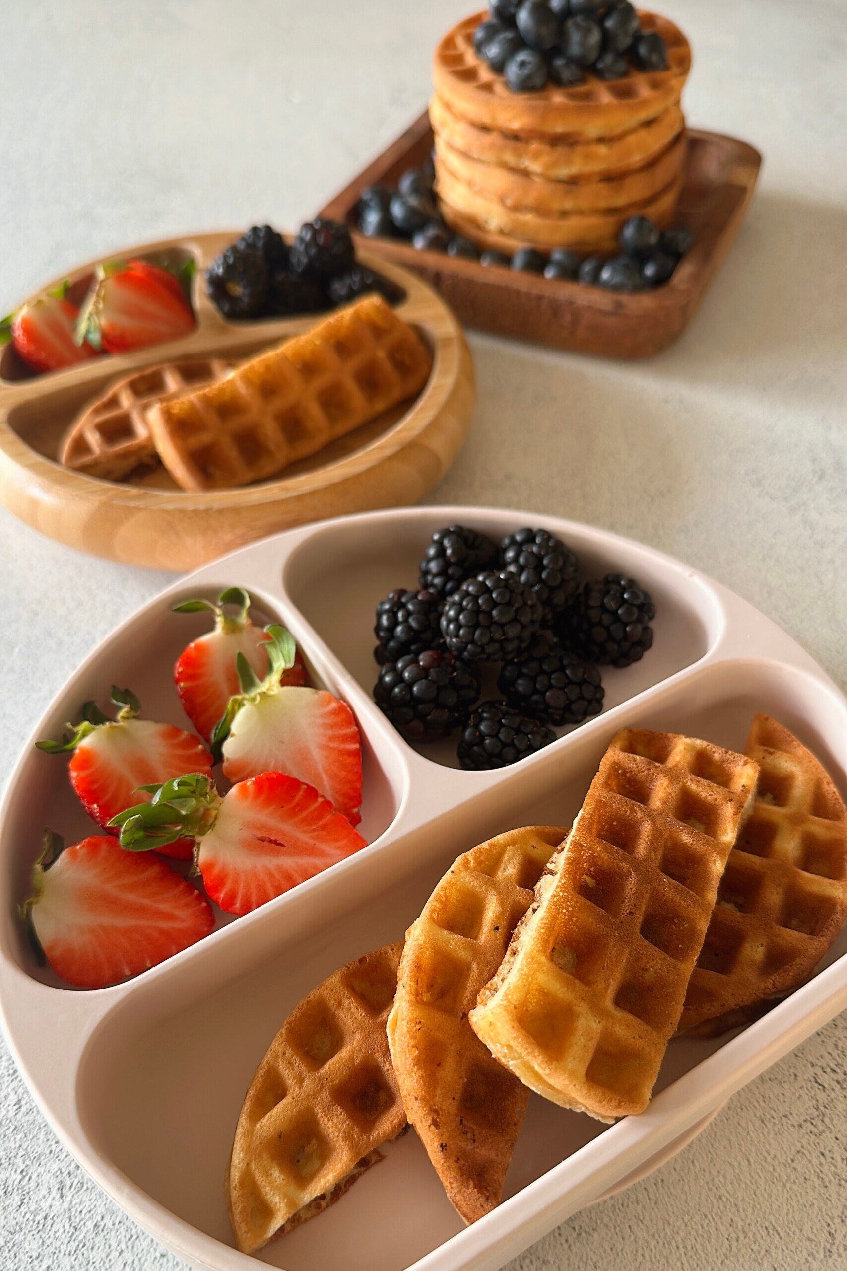 Mini waffles served with berries.