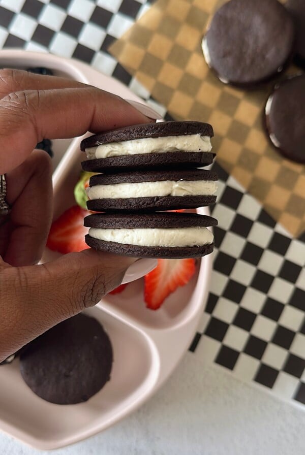 Homemade oreo cookies served with berries.