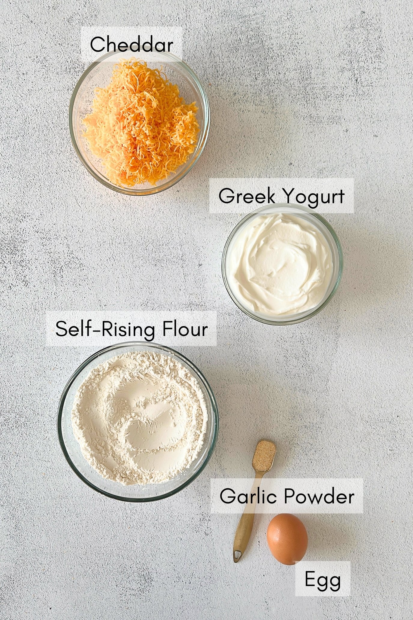 Ingredients to make cheddar bagels.