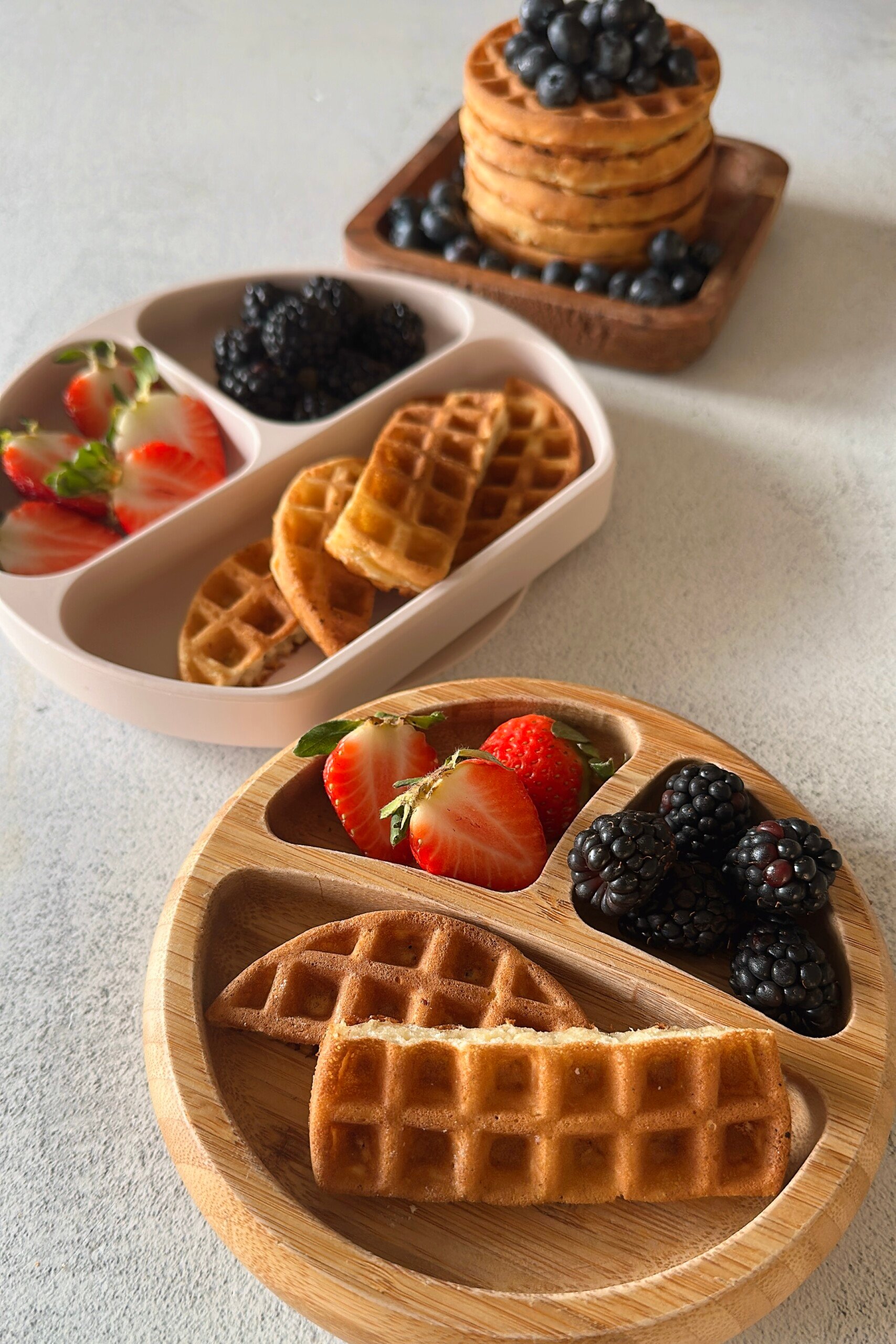 Mini waffles served with berries.
