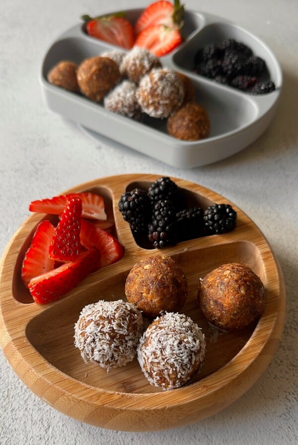 Carrot cake bliss balls served with berries.