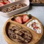 Coconut banana cookies served with yogurt and strawberries.