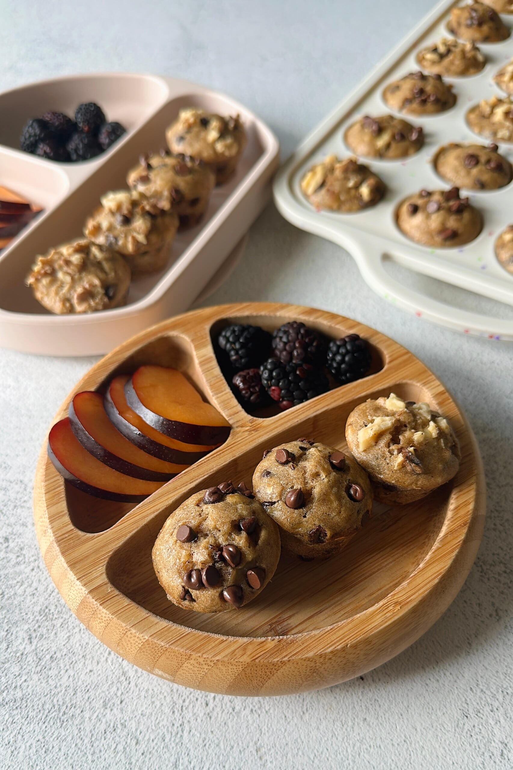 Chocolate chip banana walnut muffins served with fruits.