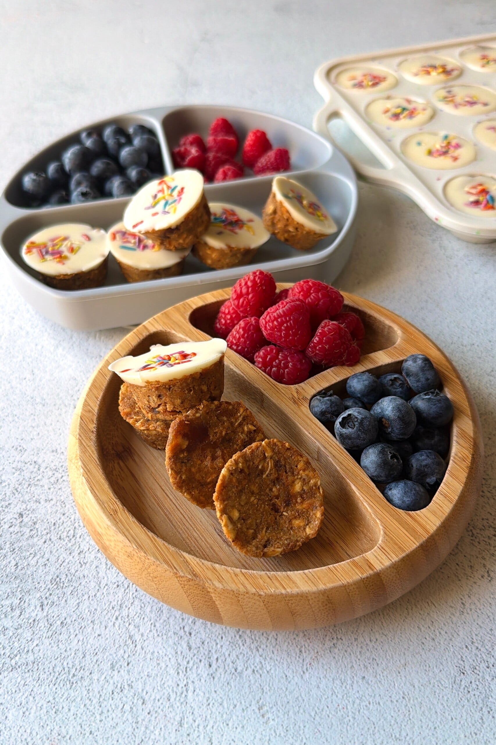 No-bake carrot cake bites served with berries.