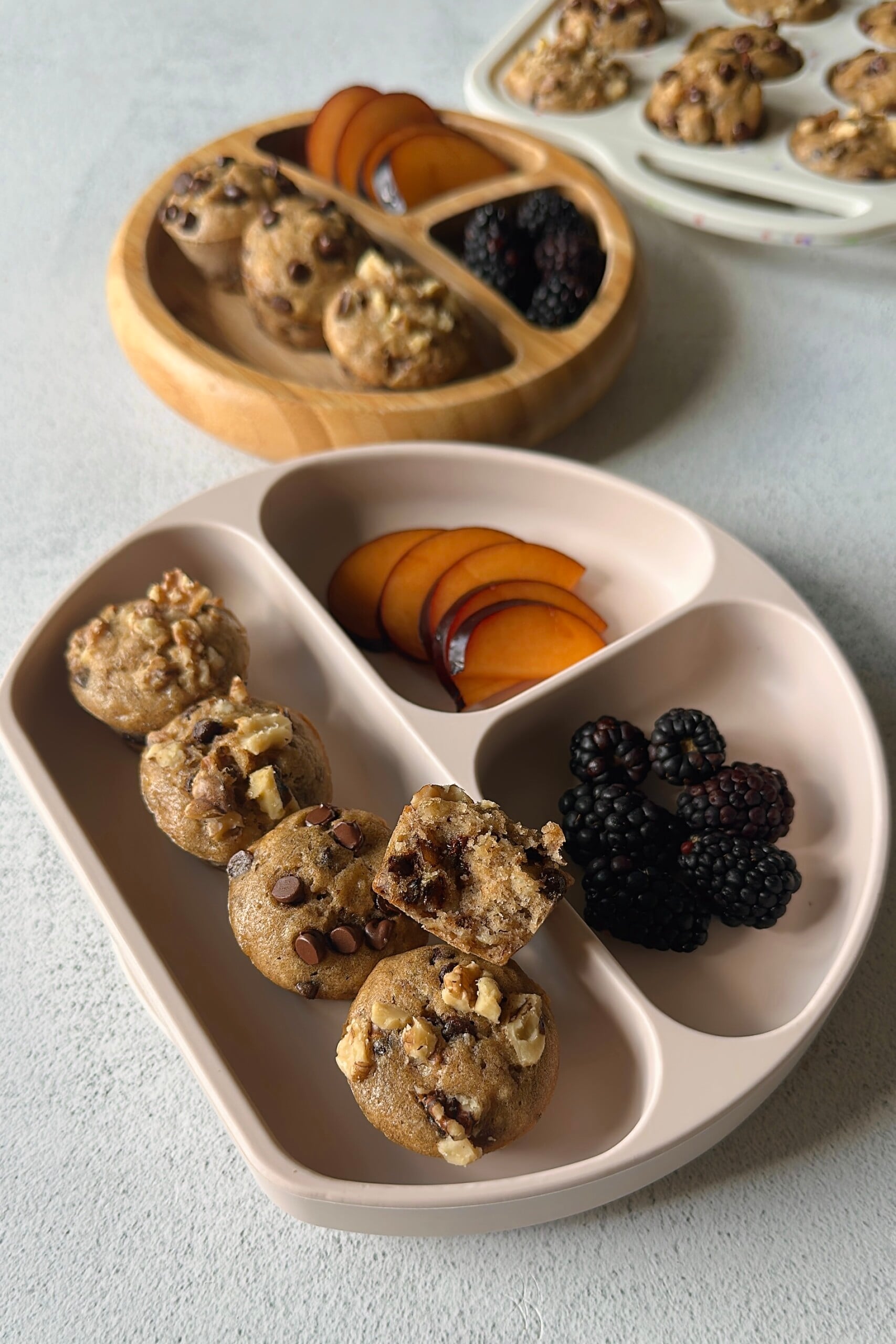 Chocolate chip banana walnut muffins served with fruits.