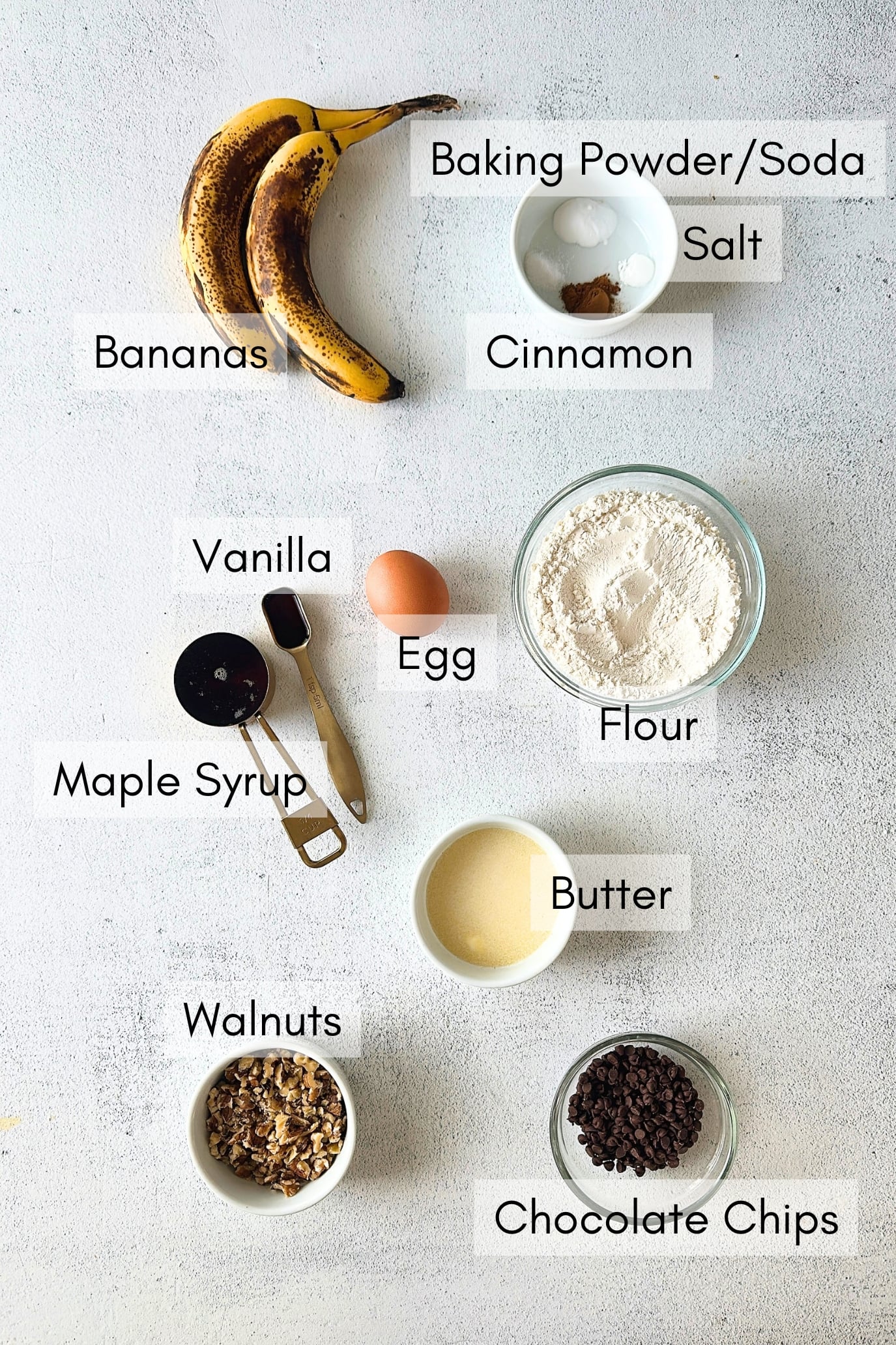 Ingredients to make chocolate chip banana walnut muffins.