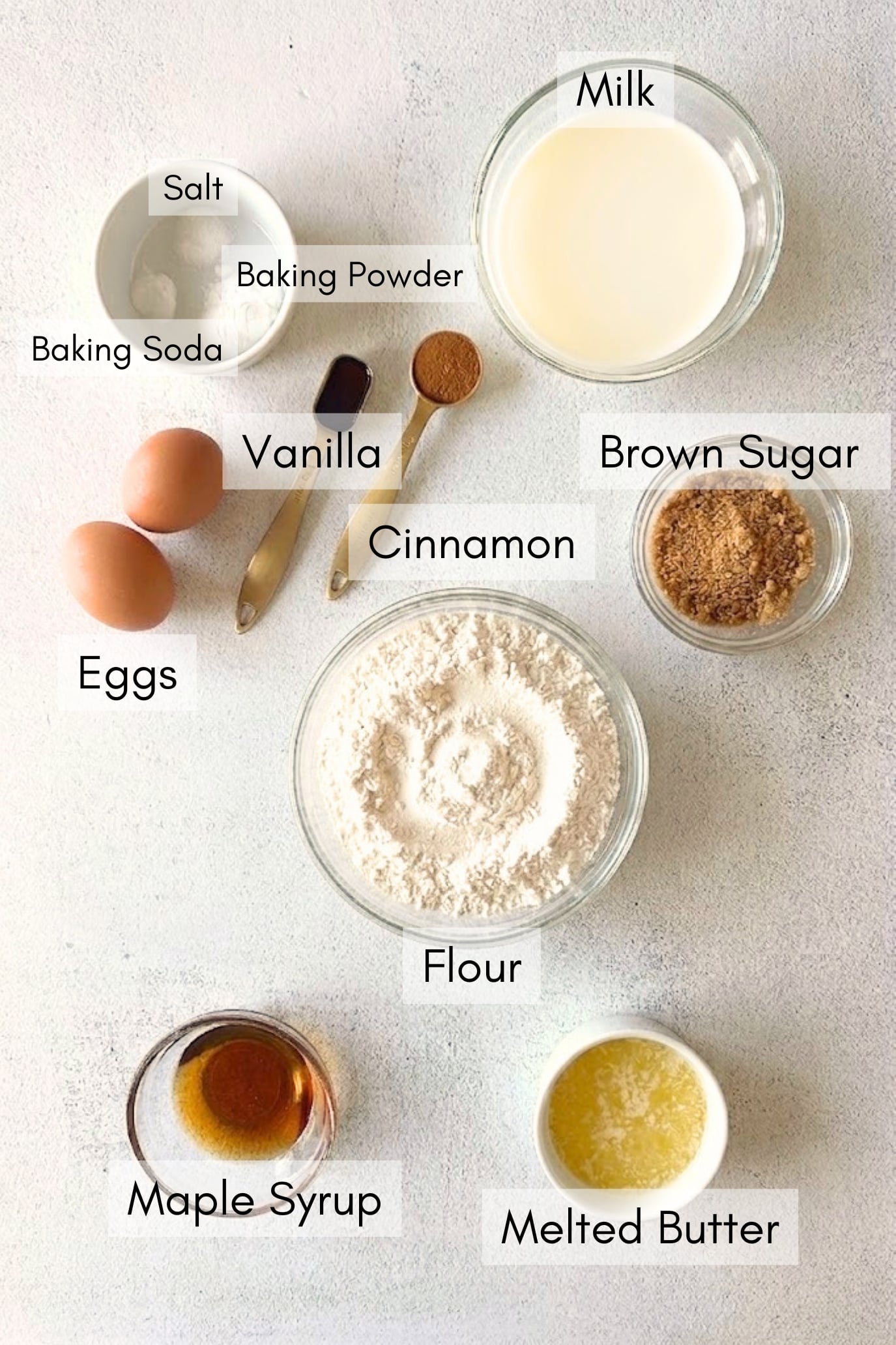 Ingredients to make cinnamon roll sheet pan pancakes.