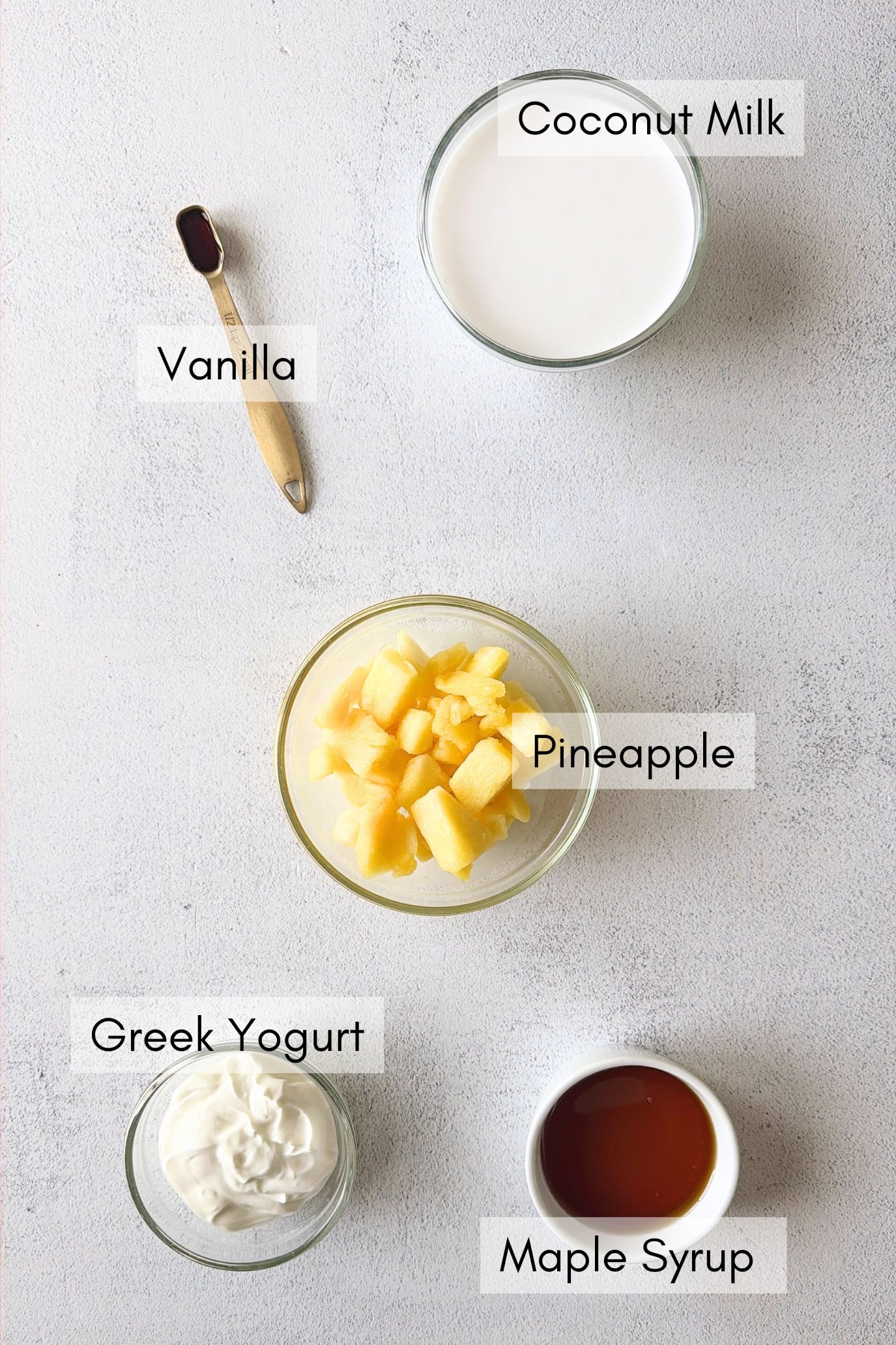 Ingredients to make pina colada pineapple popsicles.
