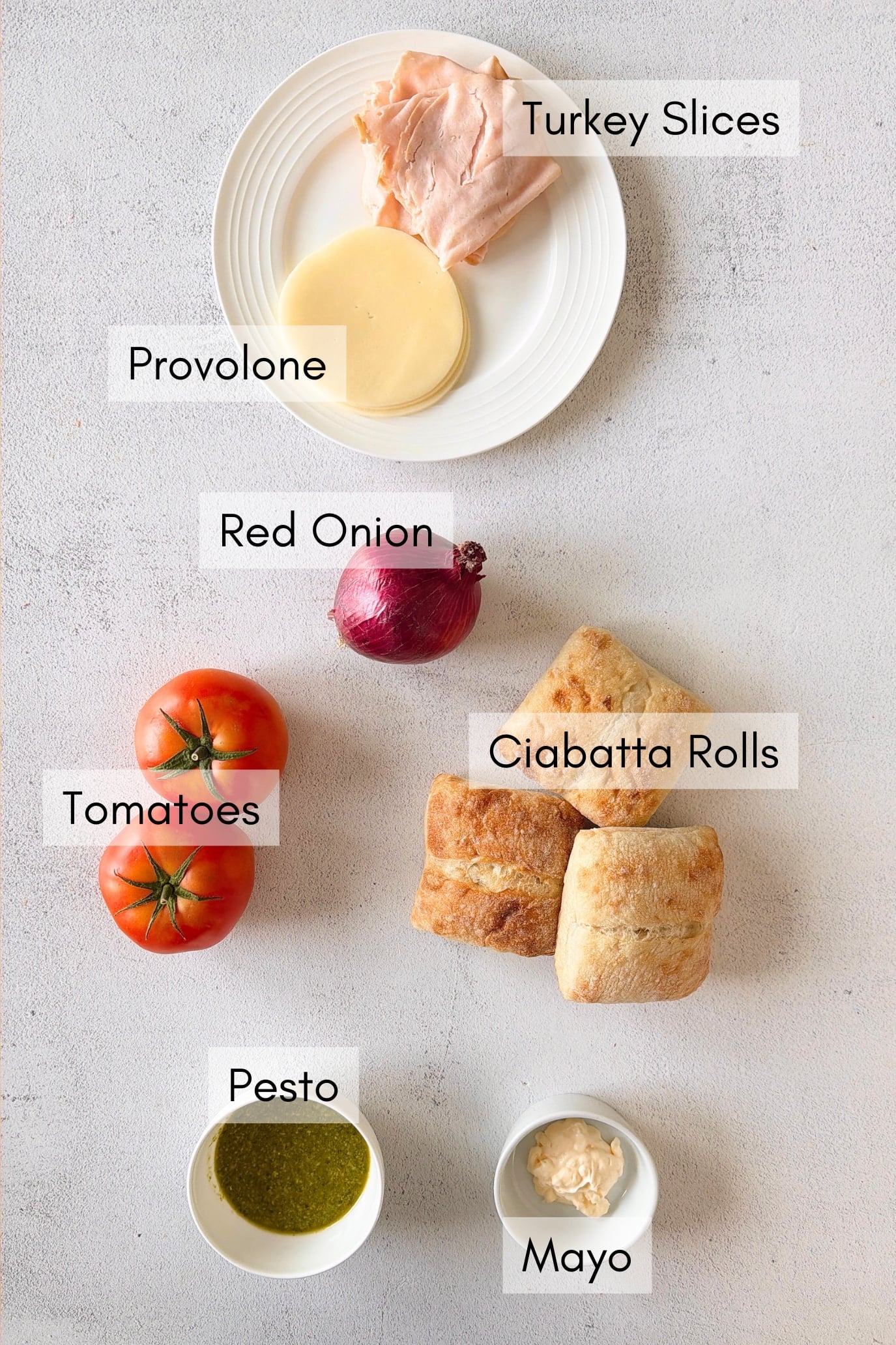 Ingredients to make turkey pesto sandwich.