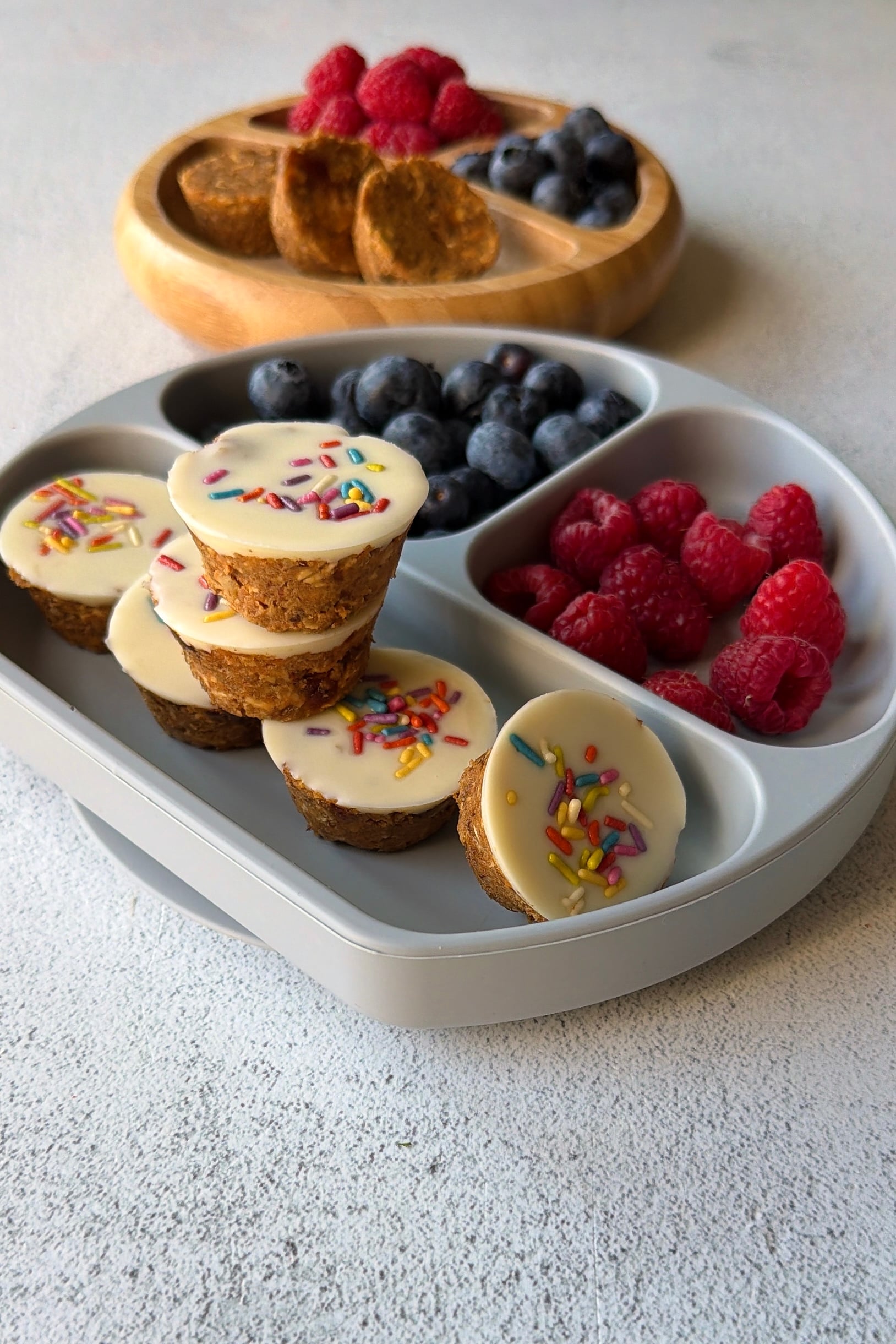 No-bake carrot cake bites served with berries.