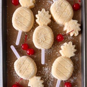 Pina colada popsicles on a tray.