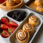 Cinnamon pinwheels served with berries.