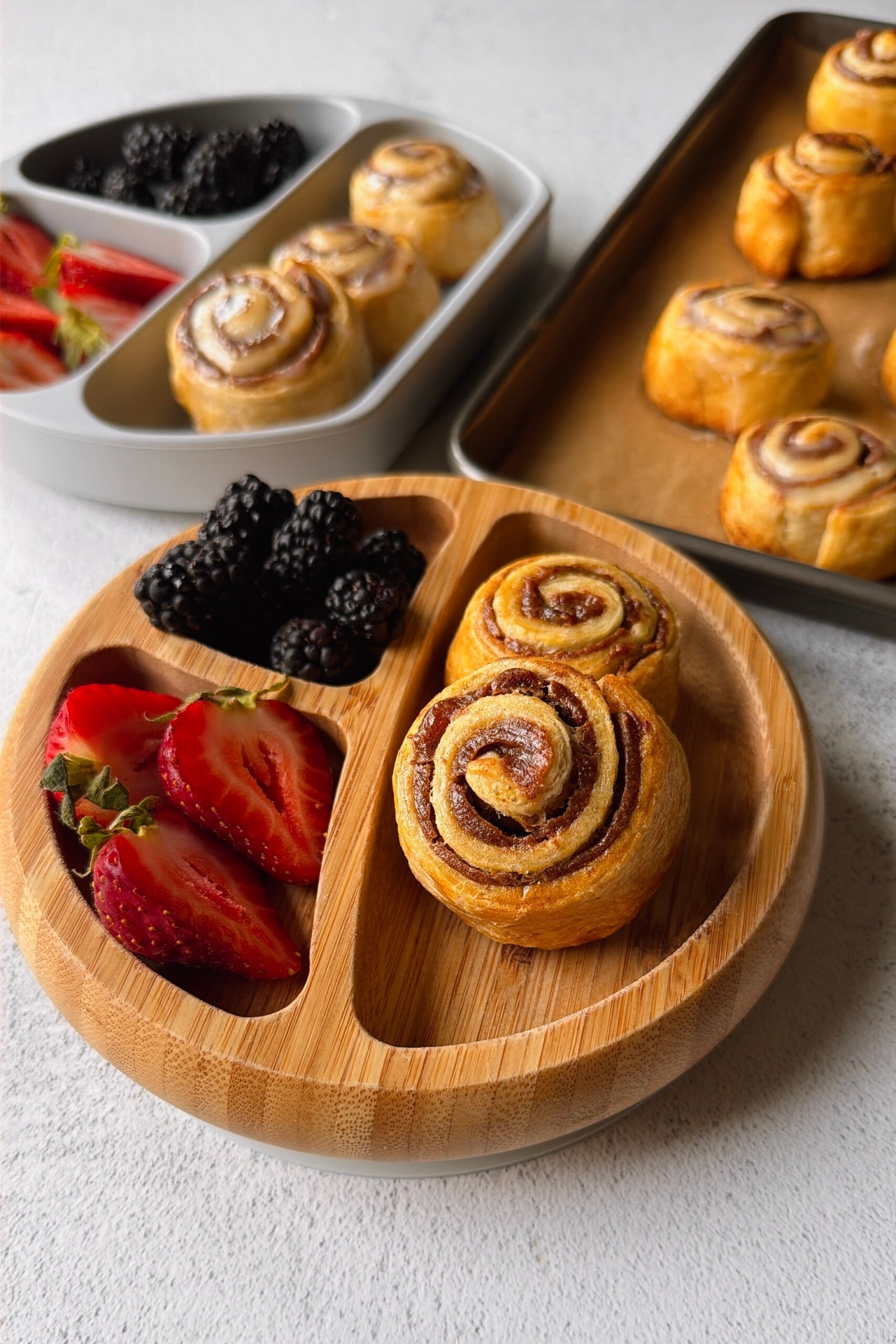 Cinnamon pinwheels served with berries.