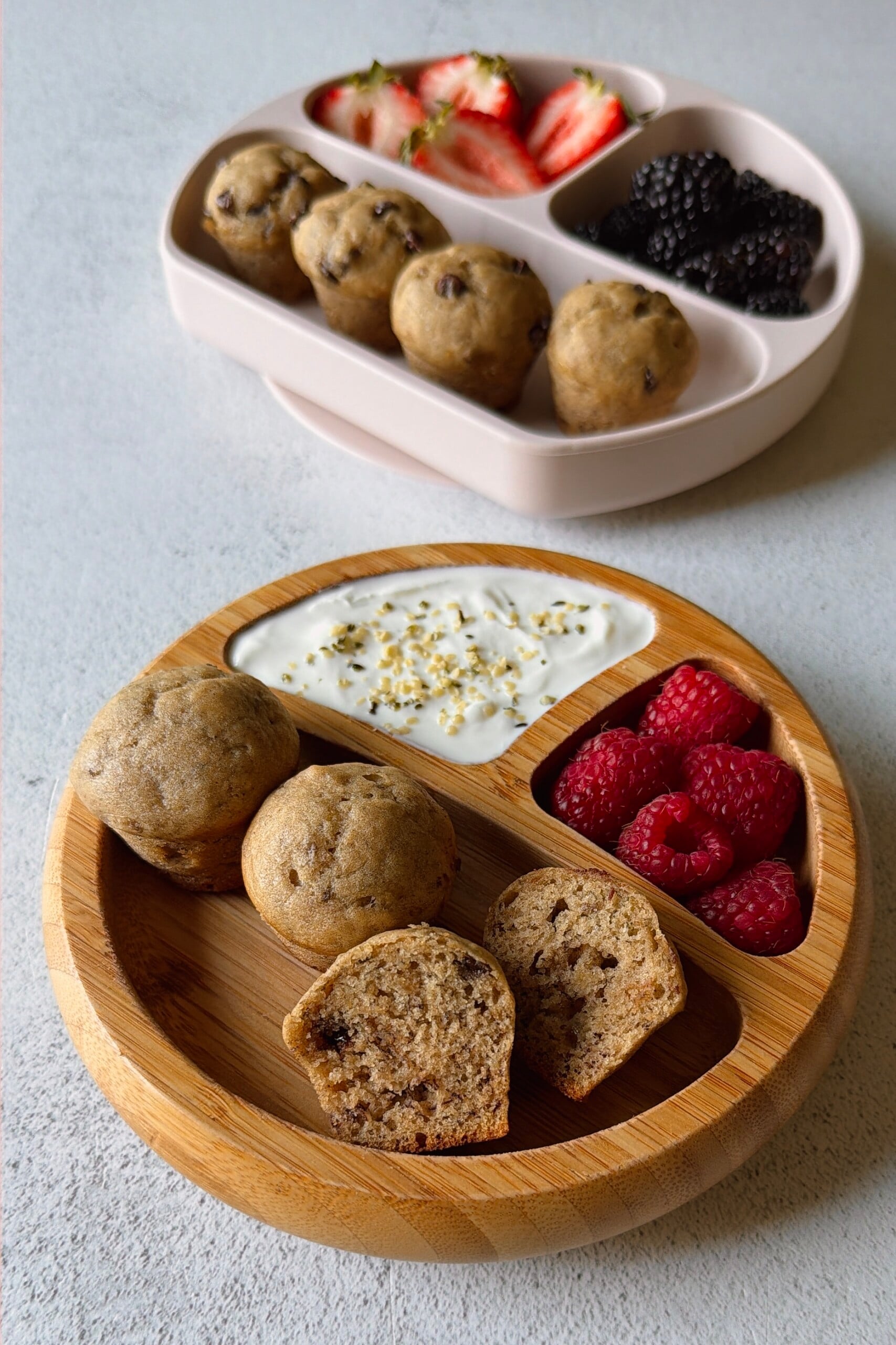 Eggless banana muffins served with berries and yogurt.