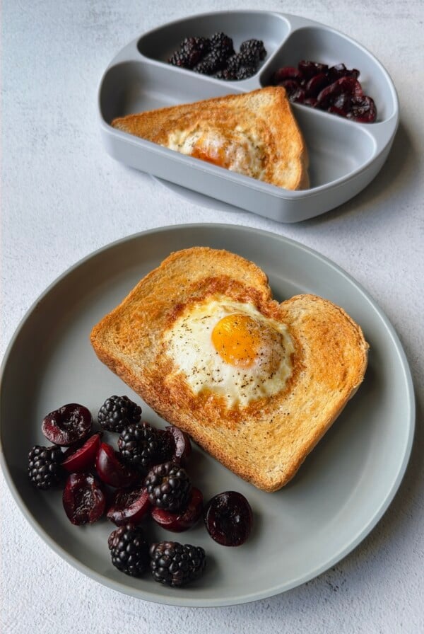 Air fryer egg toast served with blackberries and cherries.