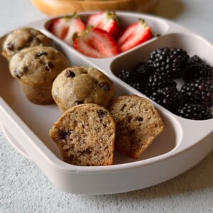 Eggless banana muffins served with berries and yogurt.